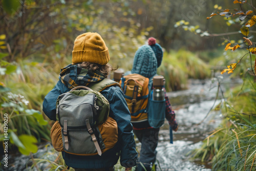 Wallpaper Mural two people walking through a stream in the woods Torontodigital.ca