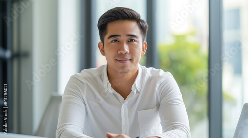 Free Download Portrait of male Filipino handsome business leader, modern bright office boardroom, professional atmosphere, leadership, diverse workplace, corporate setting. - GFXLoad