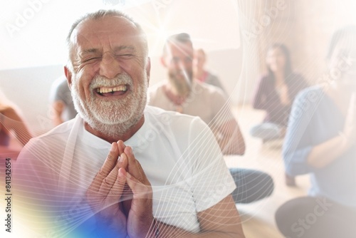 Smiling old man in yoga class photo