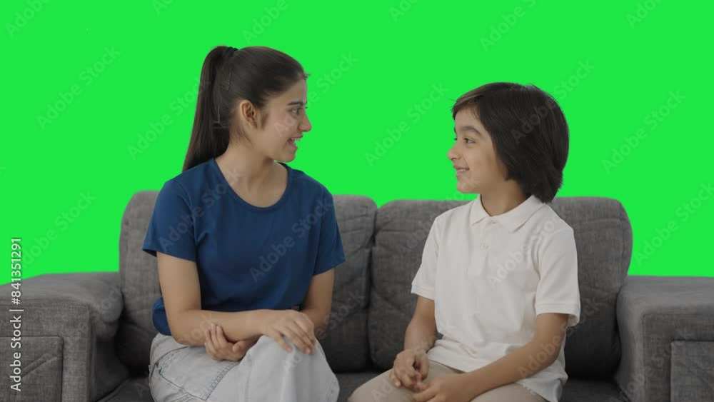 Happy Indian cousins talking to each other Green screen Happy Indian cousins talking to each other Green screen