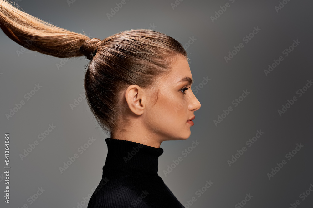 A young, beautiful woman is depicted with her long hair styled into a ponytail, exuding elegance and grace. A young, beautiful woman is depicted with her long hair styled into a ponytail, exuding elegance and grace.