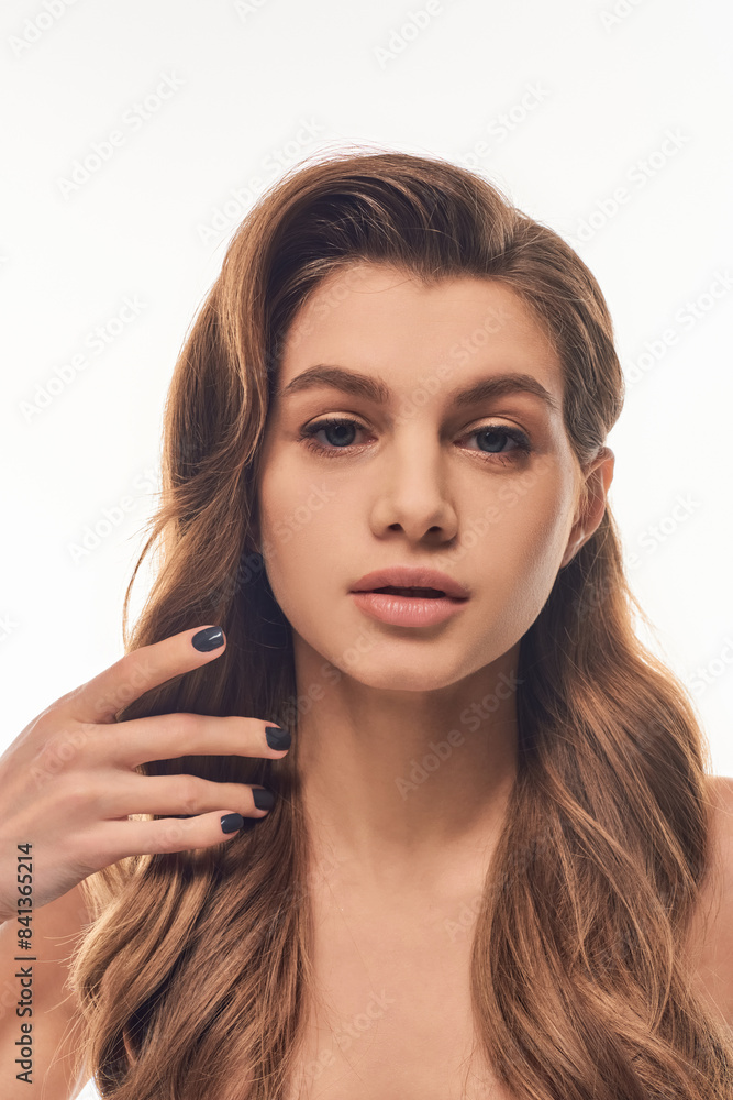 A young, beautiful woman with long, wavy hair A young, beautiful woman with long, wavy hair