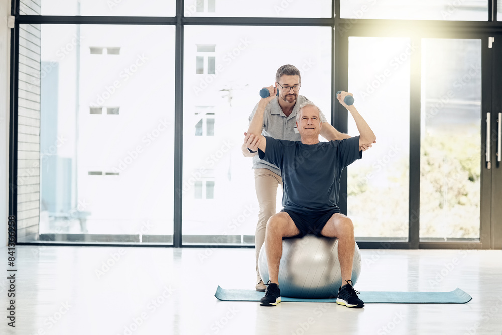 Help, physiotherapy and old man with dumbbells, gym ball and rehabilitation in senior care. Physiotherapist, consultant and elderly patient in mobility training, exercise and healthcare in retirement Help, physiotherapy and old man with dumbbells, gym ball and rehabilitation in senior care. Physiotherapist, consultant and elderly patient in mobility training, exercise and healthcare in retirement