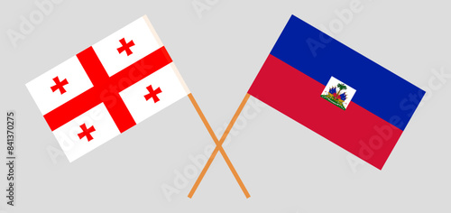 Crossed flags of Georgia and Haiti. Official colors. Correct proportion