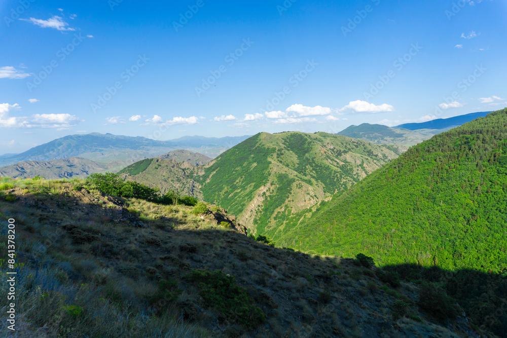 Naklejka premium Mountain landscape and Caucasus ridge covered with clouds