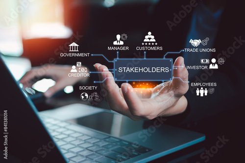 Stakeholders concept. Person touching stakeholders icon on virtual screen for business finance stakeholder investment management. Different stakeholders contact collaboration for company organization