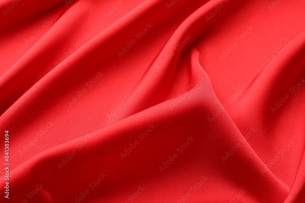Crumpled red silk fabric as background, closeup Crumpled red silk fabric as background, closeup