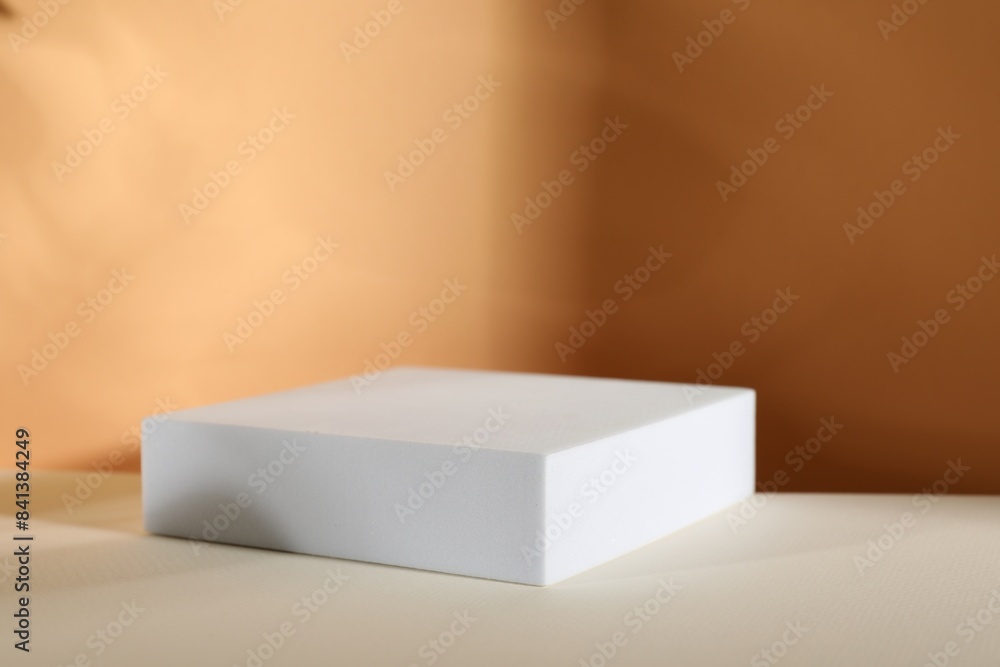Presentation of product. Podium and shadows on orange background. Space for text Presentation of product. Podium and shadows on orange background. Space for text