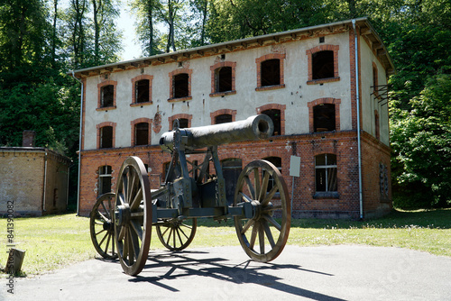 Fototapeta Naklejka Na Ścianę i Meble -  Cannon and building at former Prussian Boyen Fortress - Gizycko, Poland