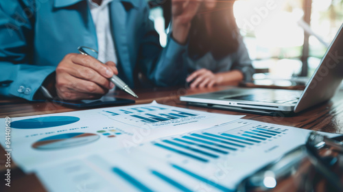 couple engaged in a discussion with a financial advisor about their retirement plans