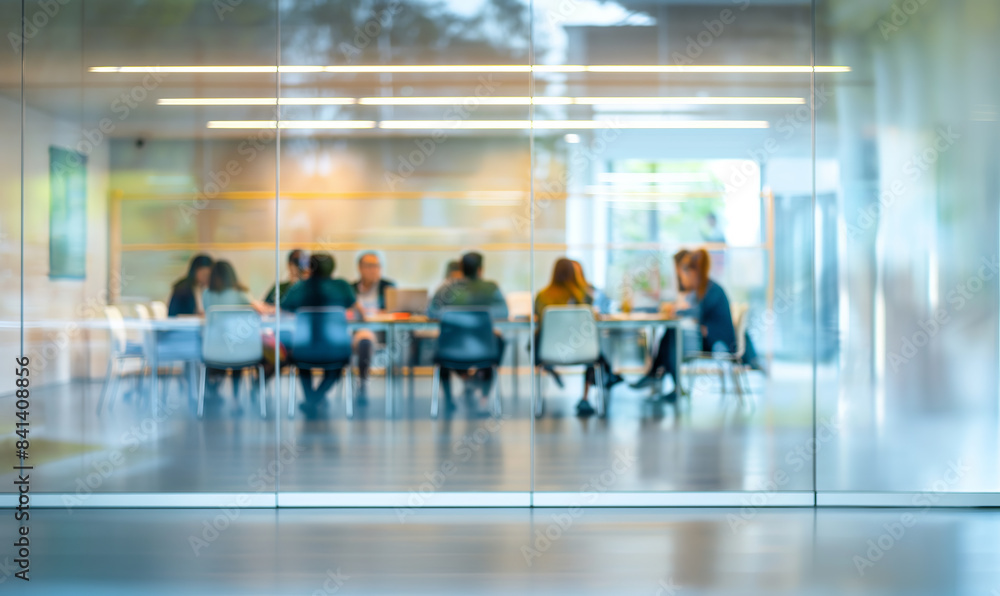 Team of professionals engaged in a business meeting in a modern glass-walled conference room, with a focus on collaboration and productivity Team of professionals engaged in a business meeting in a modern glass-walled conference room, with a focus on collaboration and productivity