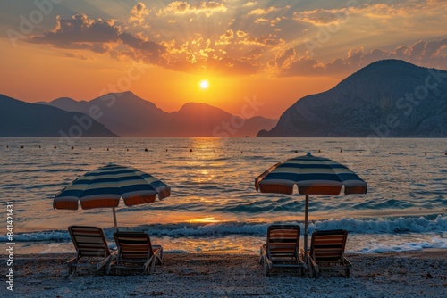 The setting sun of an evening summer beach in Alanya gilded the waters of the Mediterranean.