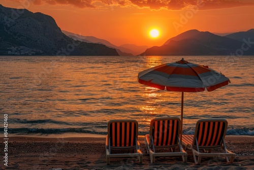 This is a peaceful seascape of the evening beach in the Turkish resort city of Alanya. The setting sun enhances the brilliant colors of the Mediterranean Sea.