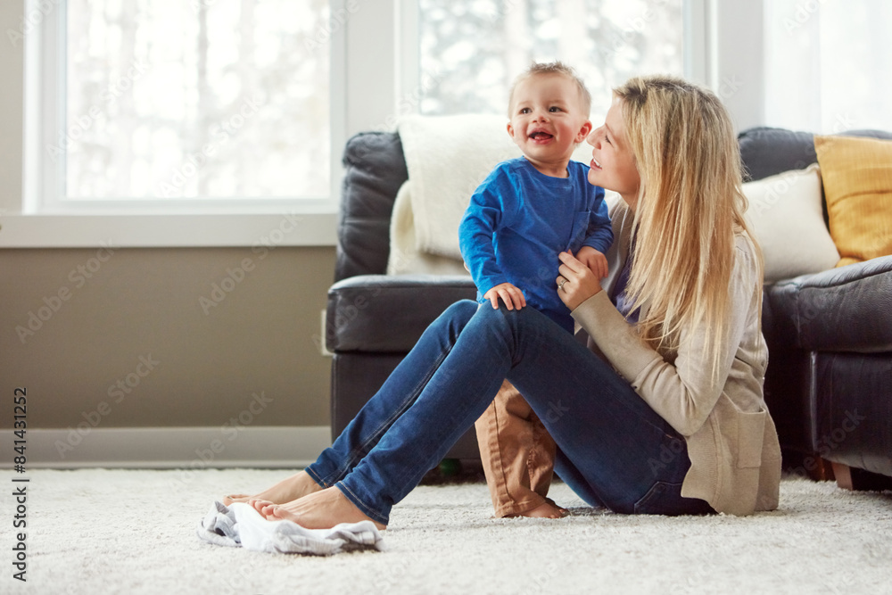 Home, smile and hug of baby by mom, living room and playful with son, love and care in apartment. House, woman and toddler in lounge, mother and child together, happiness and wellness for boy
