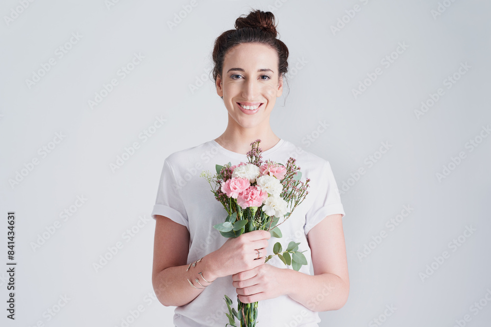 Happy woman, portrait and plant with flower bouquet for anniversary, gift or valentines day on a white studio background. Female person or model with smile, natural leaves or stem for bloom or love Happy woman, portrait and plant with flower bouquet for anniversary, gift or valentines day on a white studio background. Female person or model with smile, natural leaves or stem for bloom or love