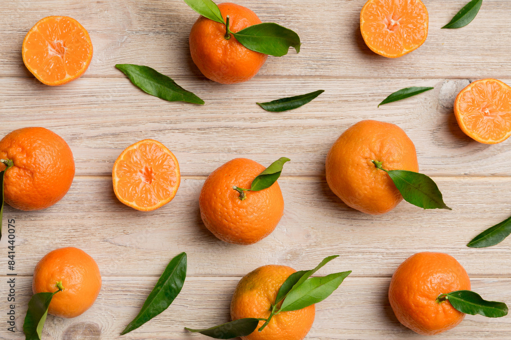 Many fresh ripe mandarin as colored background, top view. Elegant background of clementines and mandarin slices Top view flat lay Many fresh ripe mandarin as colored background, top view. Elegant background of clementines and mandarin slices Top view flat lay