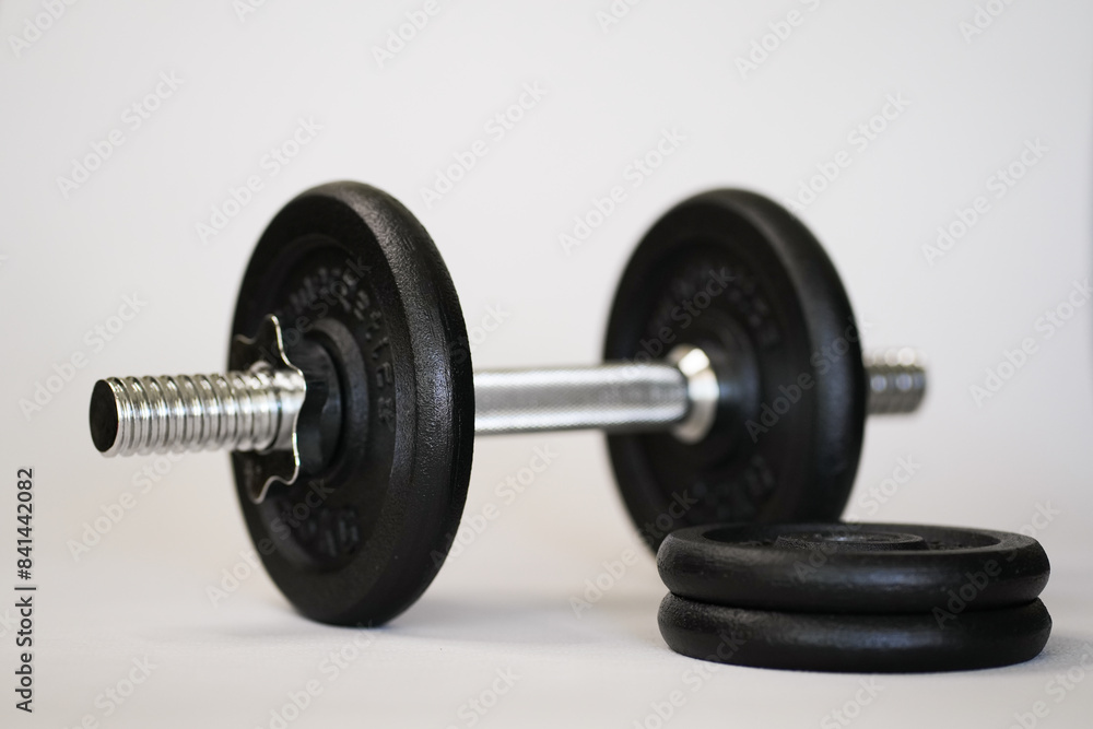 Naklejka premium Dumbbells for sports are on a white background
