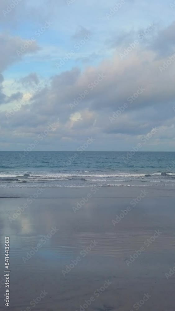 Aerial view of tropical beach island and ocean, flying to horizon. Drone flying away in sea from the beach. Vertical shot. Aerial view of tropical beach island and ocean, flying to horizon. Drone flying away in sea from the beach. Vertical shot.