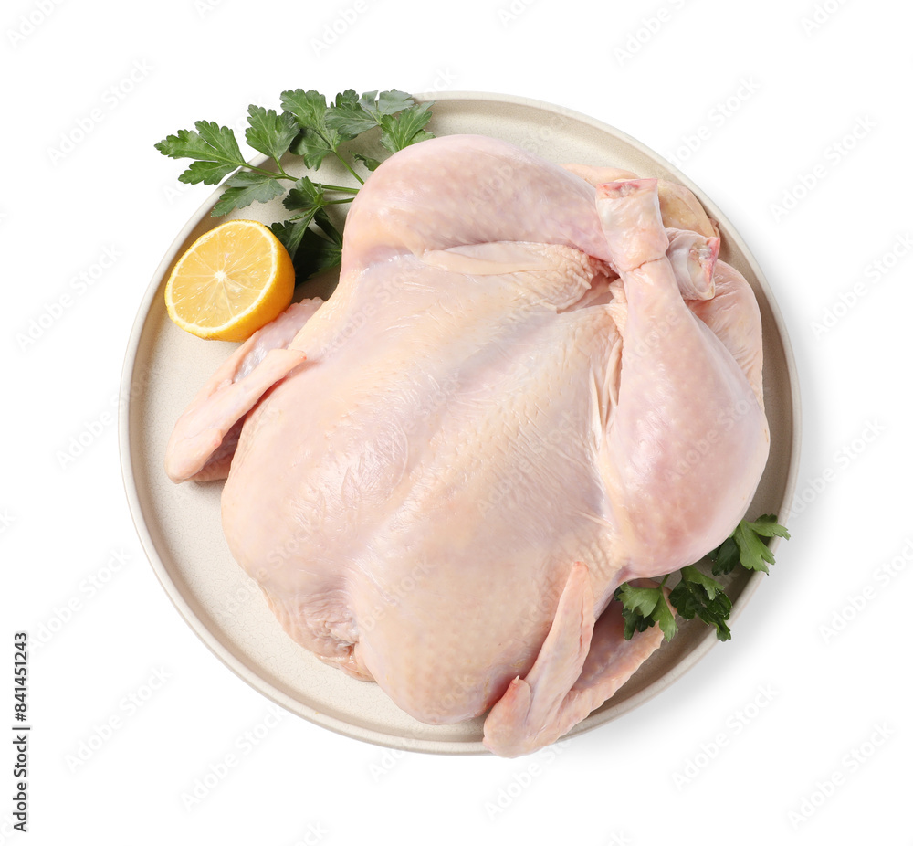 Fresh raw chicken with lemon and parsley isolated on white, top view Fresh raw chicken with lemon and parsley isolated on white, top view