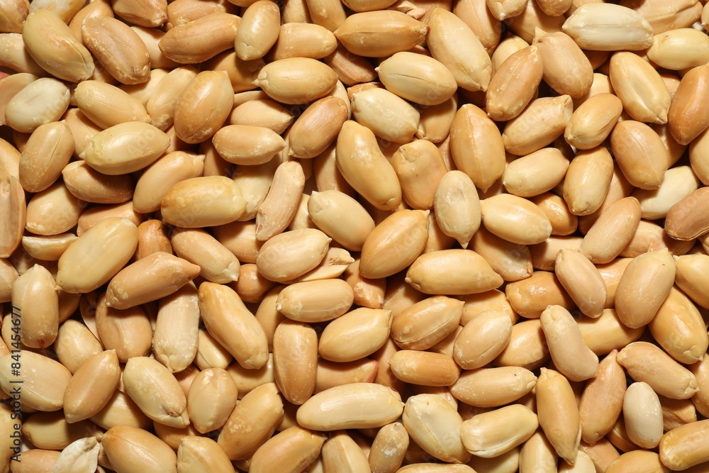 Fresh peeled peanuts as background, top view Fresh peeled peanuts as background, top view