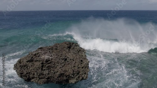 Aerial Slow Mo Crashing Waves Tropical Island - Hinnamnor photo