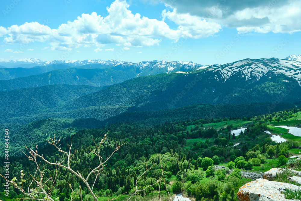 Naklejka premium View of mountains in summer and snowy peaks.