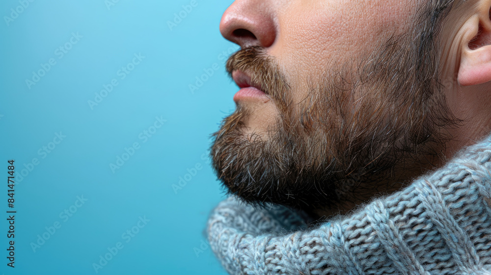 Obraz premium A man with a beard and a scarf around his neck