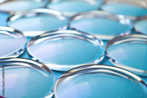 Fototapeta Eyeglasses lens production industry, close-up eyeglasses lenses, eyeglasses lens