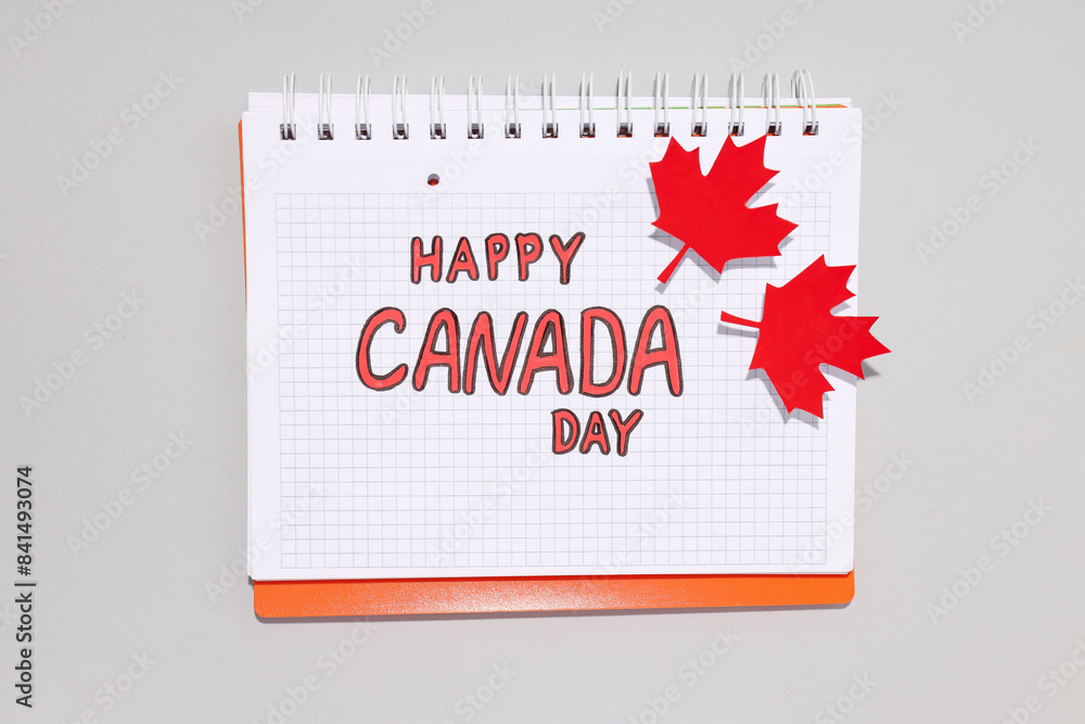 The inscription Happy Canada Day in a notebook The inscription Happy Canada Day in a notebook