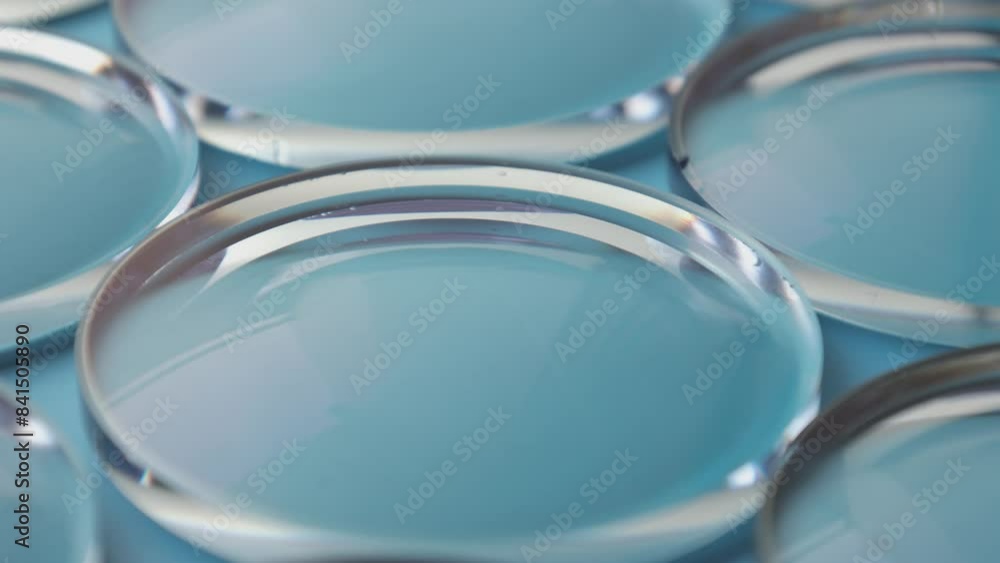 Eyeglass lens manufacturing industry, close-up of eyeglass lenses, eyeglass lenses, eyeglass glass lenses Eyeglass lens manufacturing industry, close-up of eyeglass lenses, eyeglass lenses, eyeglass glass lenses