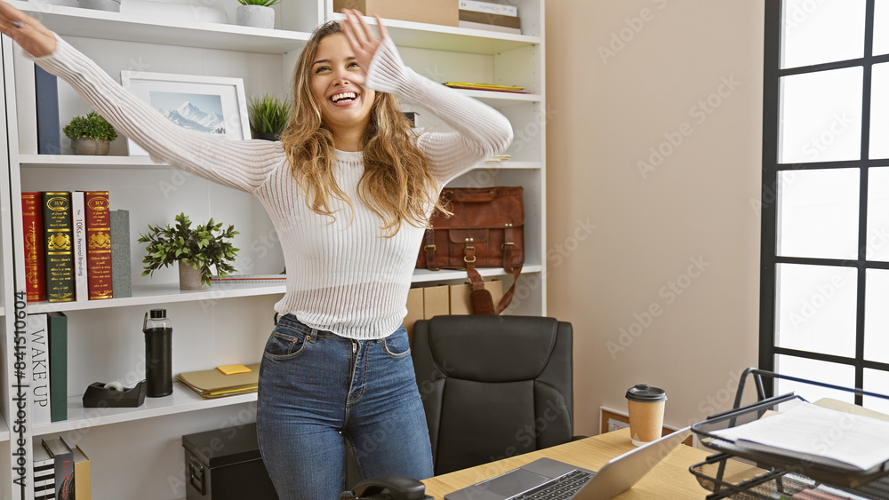 Young, confident hispanic woman enjoys dancing, smiling gleefully at her desk! professional yet joyous, the ambiance at her office is simply beautiful. Young, confident hispanic woman enjoys dancing, smiling gleefully at her desk! professional yet joyous, the ambiance at her office is simply beautiful.