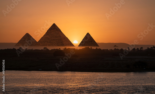 Giza pyramids view from Nile river at amazing sunset - Cairo  Egypt