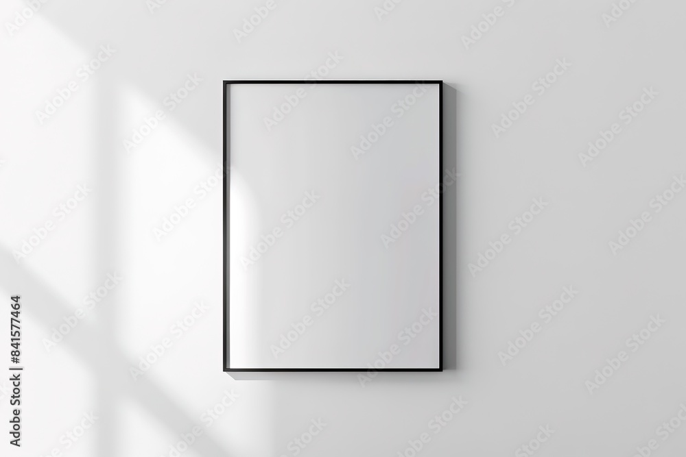 Minimalist blank frame on a white wall with soft shadows Minimalist blank frame on a white wall with soft shadows