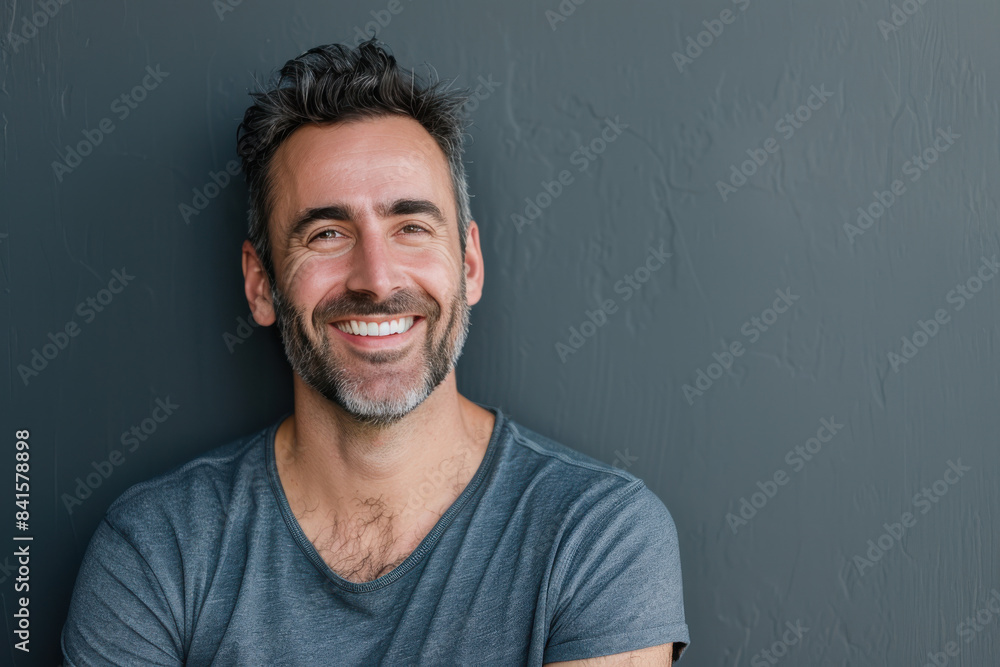 A close up portrait of a young man with a subtle smile A close up portrait of a young man with a subtle smile