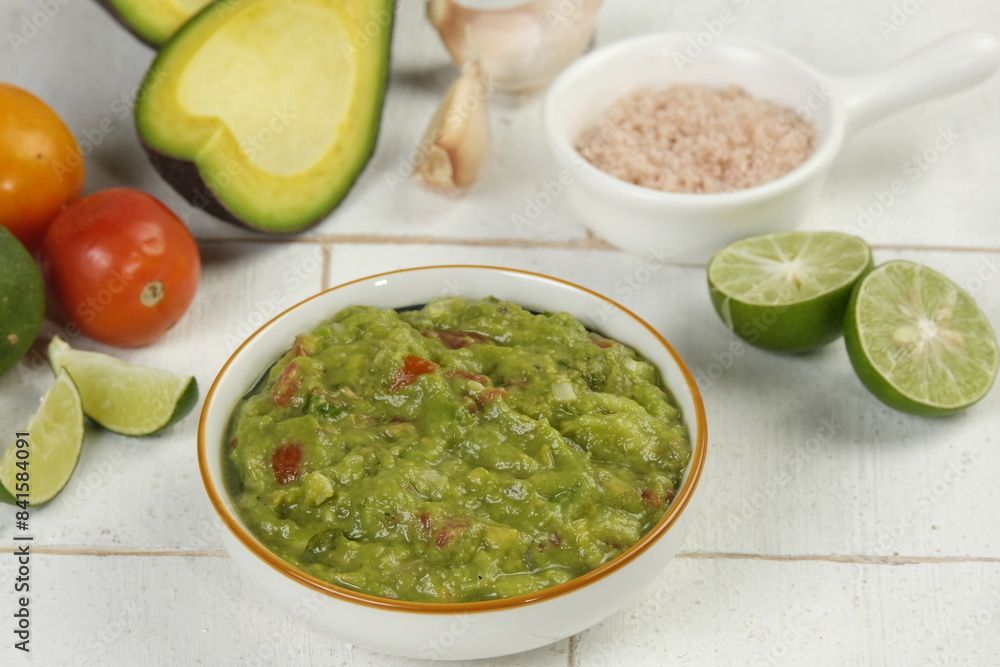 homemade guacamole dip in a bowl with ingredient homemade guacamole dip in a bowl with ingredient
