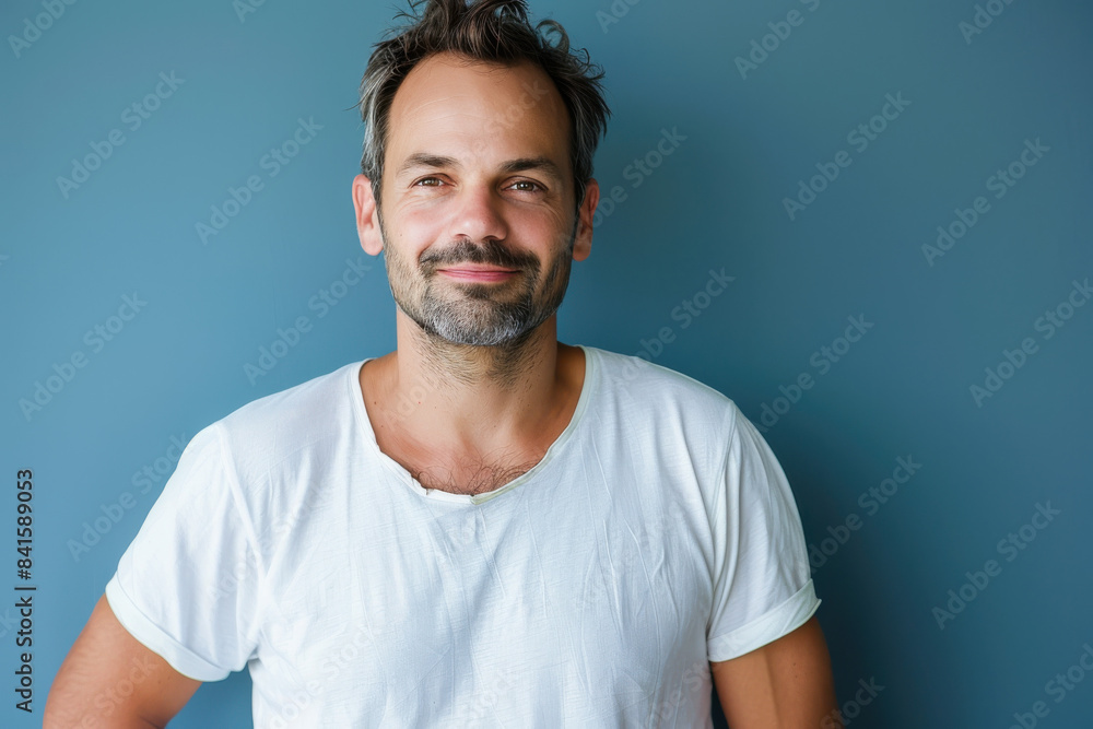 A close up portrait of a young man with a subtle smile A close up portrait of a young man with a subtle smile