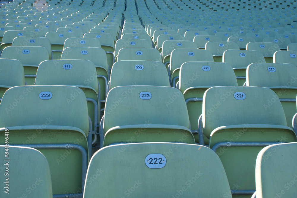 Naklejka premium A row of empty seats in a stadium with numbers on them
