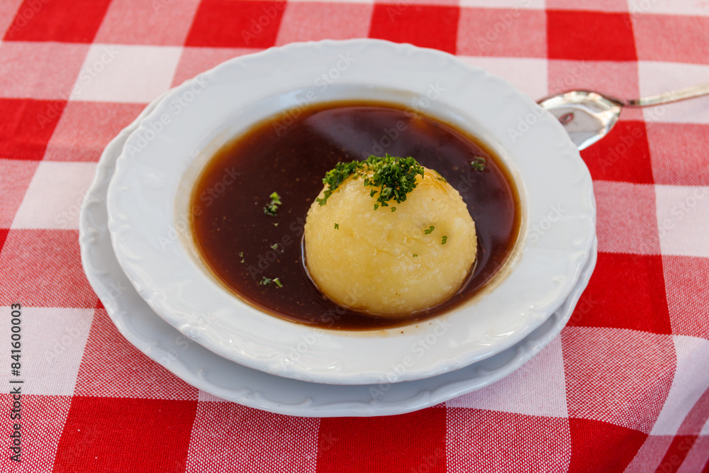 German potato dumpling in sauce on a table German potato dumpling in sauce on a table