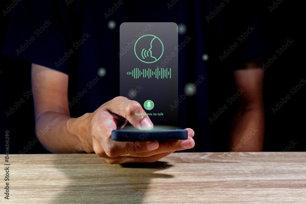 © fadfebrian - Man using virtual voice assistant on a smart phone © fadfebrian - Man using virtual voice assistant on a smart phone