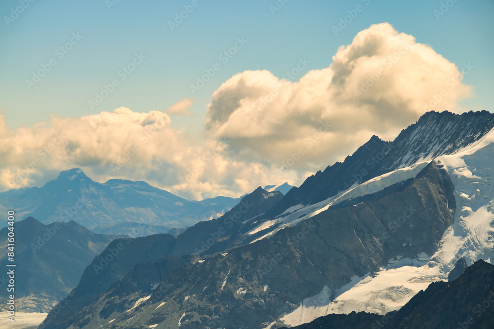 The sky is cloudy and the mountains are covered in snow The sky is cloudy and the mountains are covered in snow