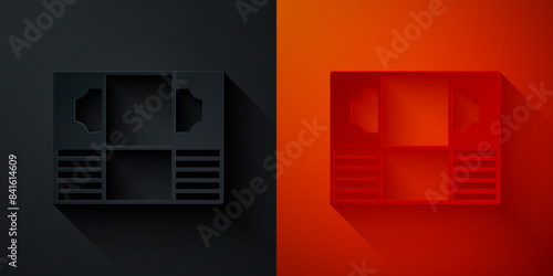 Paper cut Stacks paper money cash icon isolated on black and red background. Money banknotes stacks. Bill currency. Paper art style. Vector