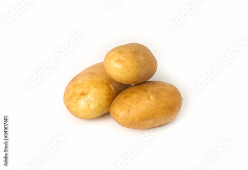 Three white potatoes on a white isolated background. Potato harvest