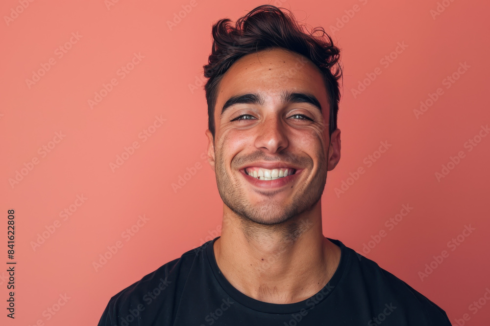 A close up portrait of a young man with a subtle smile