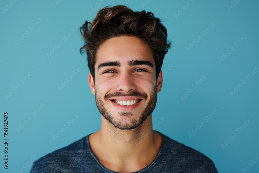 Fototapeta premium A close up portrait of a young man with a subtle smile