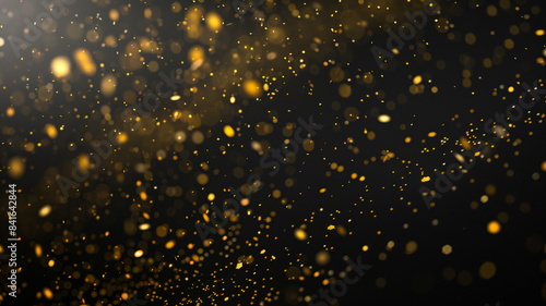 Elegant black background with scattered gold confetti or particles, perfect for a celebratory and festive atmosphere. photo