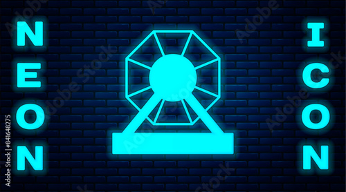Glowing neon Lottery machine icon isolated on brick wall background. Lotto bingo game of luck concept. Wheel drum leisure. Vector