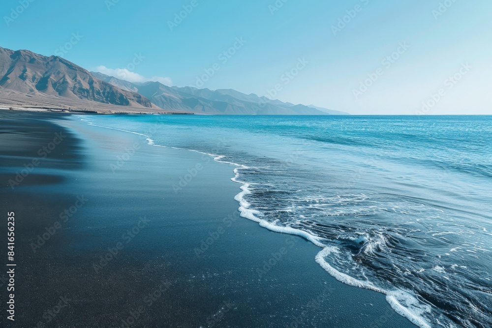 Scenic Coastal Landscape of Rugged Mountains and Black Sand Beach Scenic Coastal Landscape of Rugged Mountains and Black Sand Beach