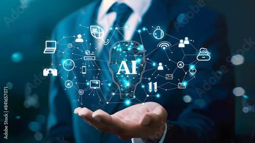 A businessman holding an AI icon with various icons floating around it. representing the integration of artificial intelligence in business and technology 