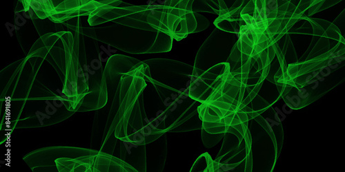 Green smoke on black background. Close-up of green smoke of incense stick against black background with spotlight.  Creative smoke photography design. 