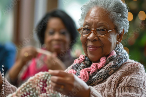 an African American retired woman teaching a knitting class